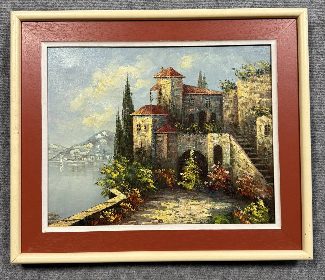 Italian School: painting of a castle on the edge of a lake