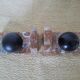 Pair of red marble bookends with black stone spheres – Art Style
