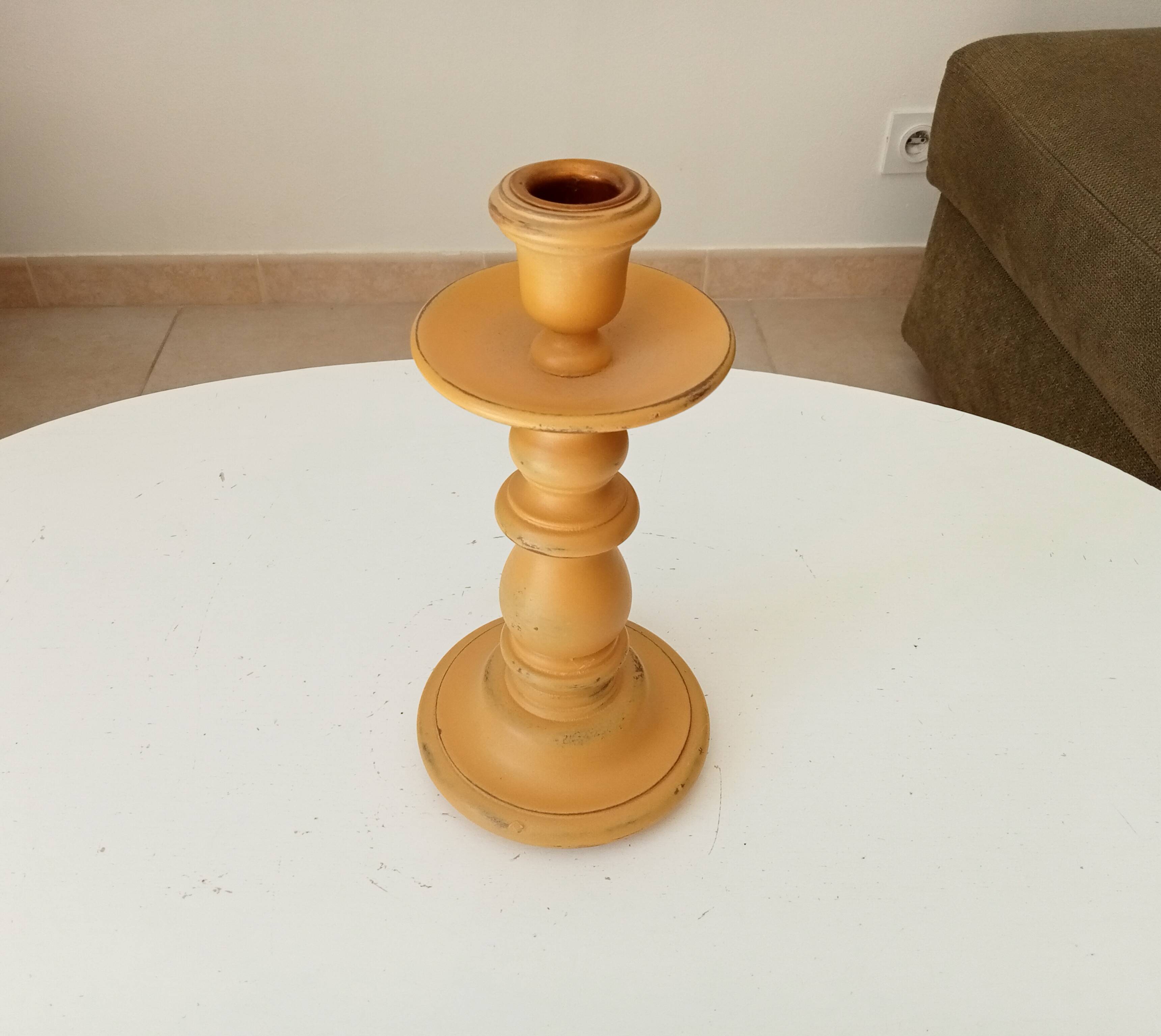 Vintage candle holder in weathered yellow wood