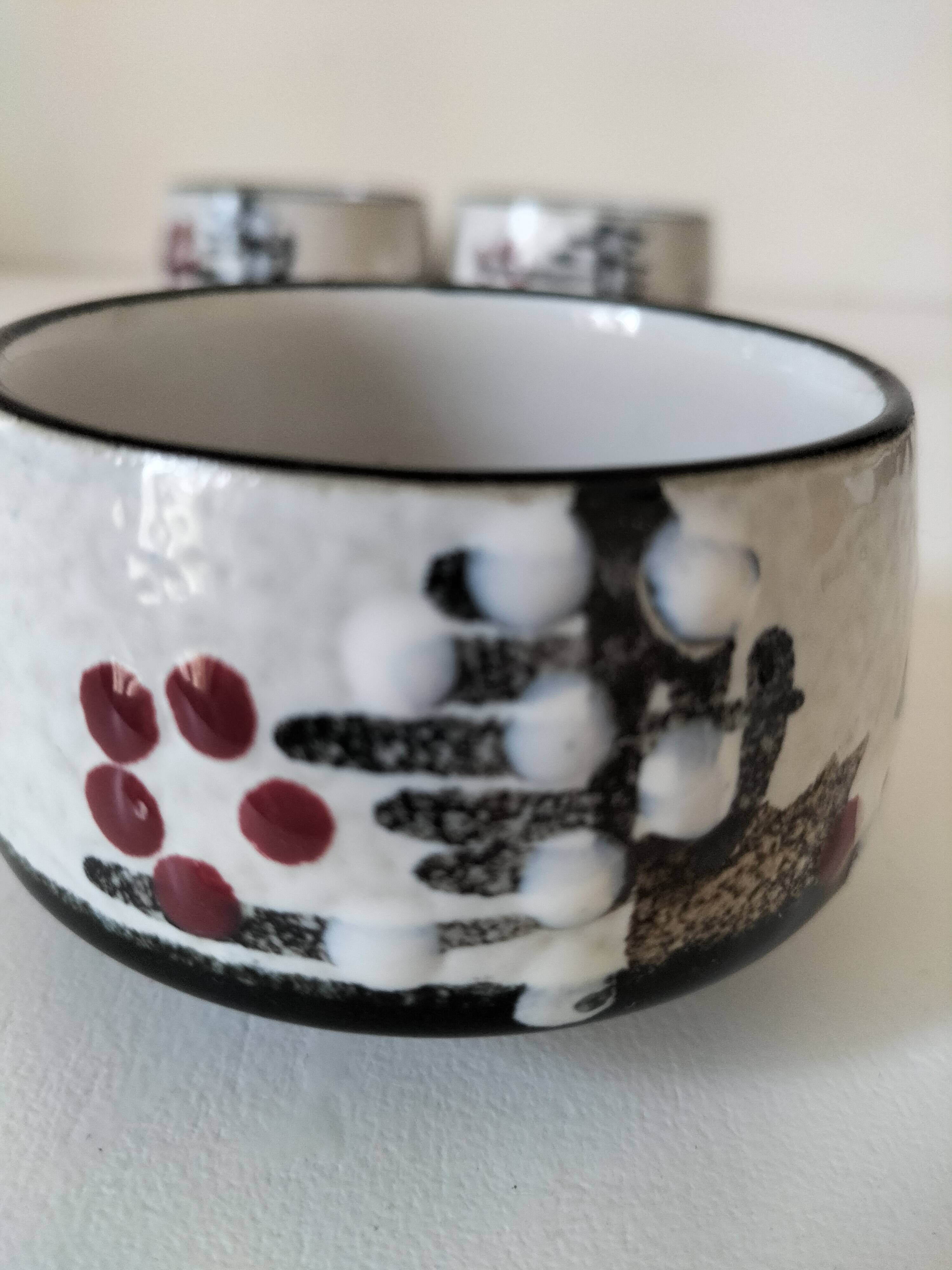 Three glazed ceramic bowls with raised graphic decoration, 1970s.