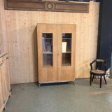 Glass-fronted school cabinet in raw oak