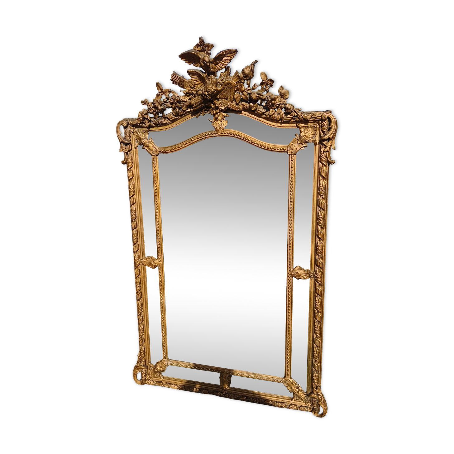 Large closed mirror, 19th century, wood and gilded stucco.