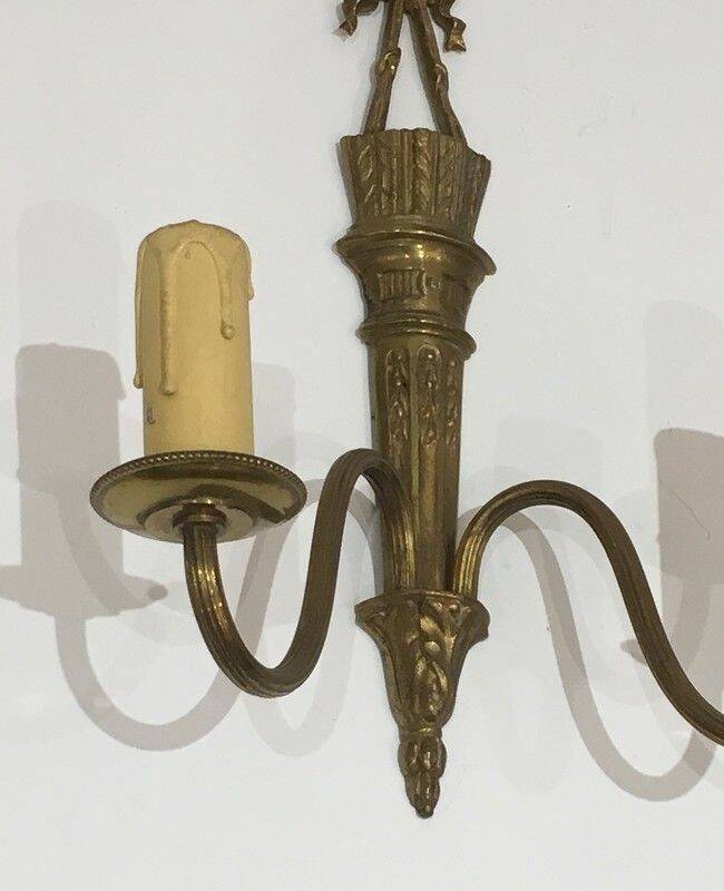 Pair of Louis XVI style bronze wall sconces with quivers and ribbons