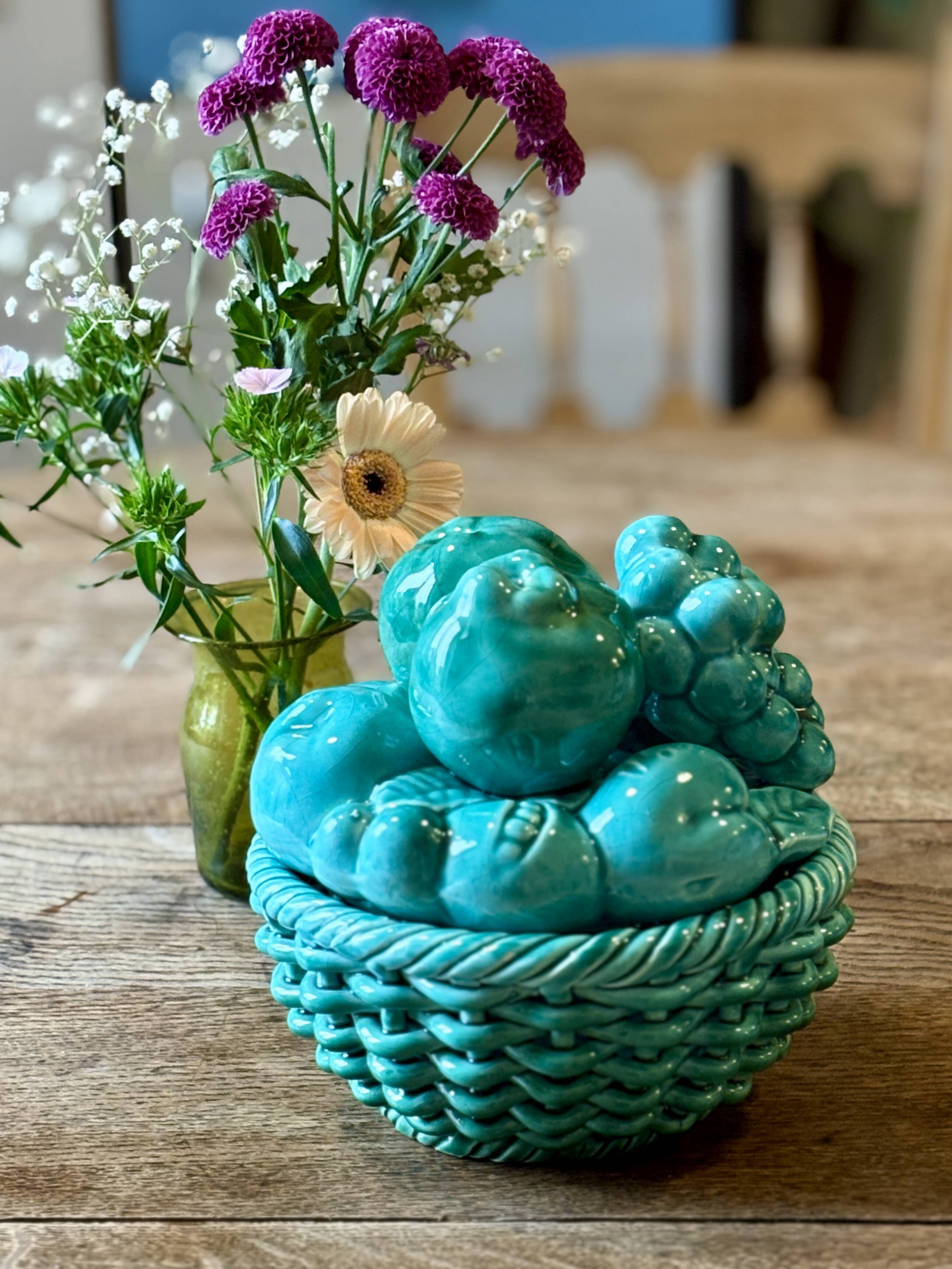 Vintage green earthenware plate/basket with fruit decorations.