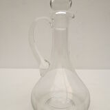 small glass decanter with its handle and spout