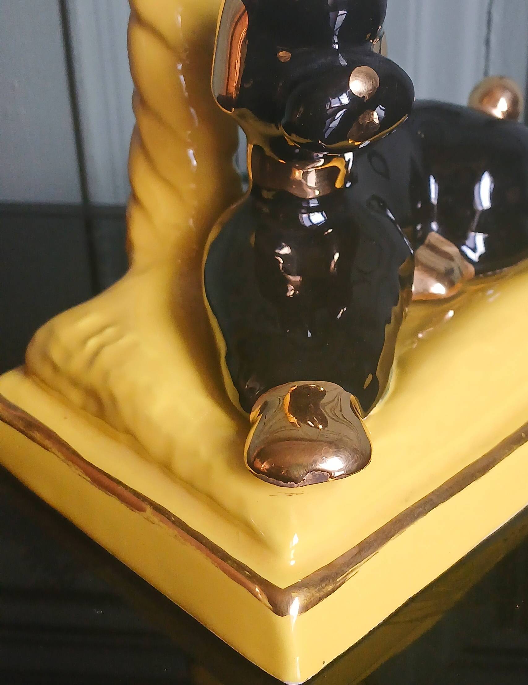 Zoomorphic lamp "poodle" in black, yellow, and gold glazed ceramic.