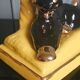 Zoomorphic lamp "poodle" in black, yellow, and gold glazed ceramic.