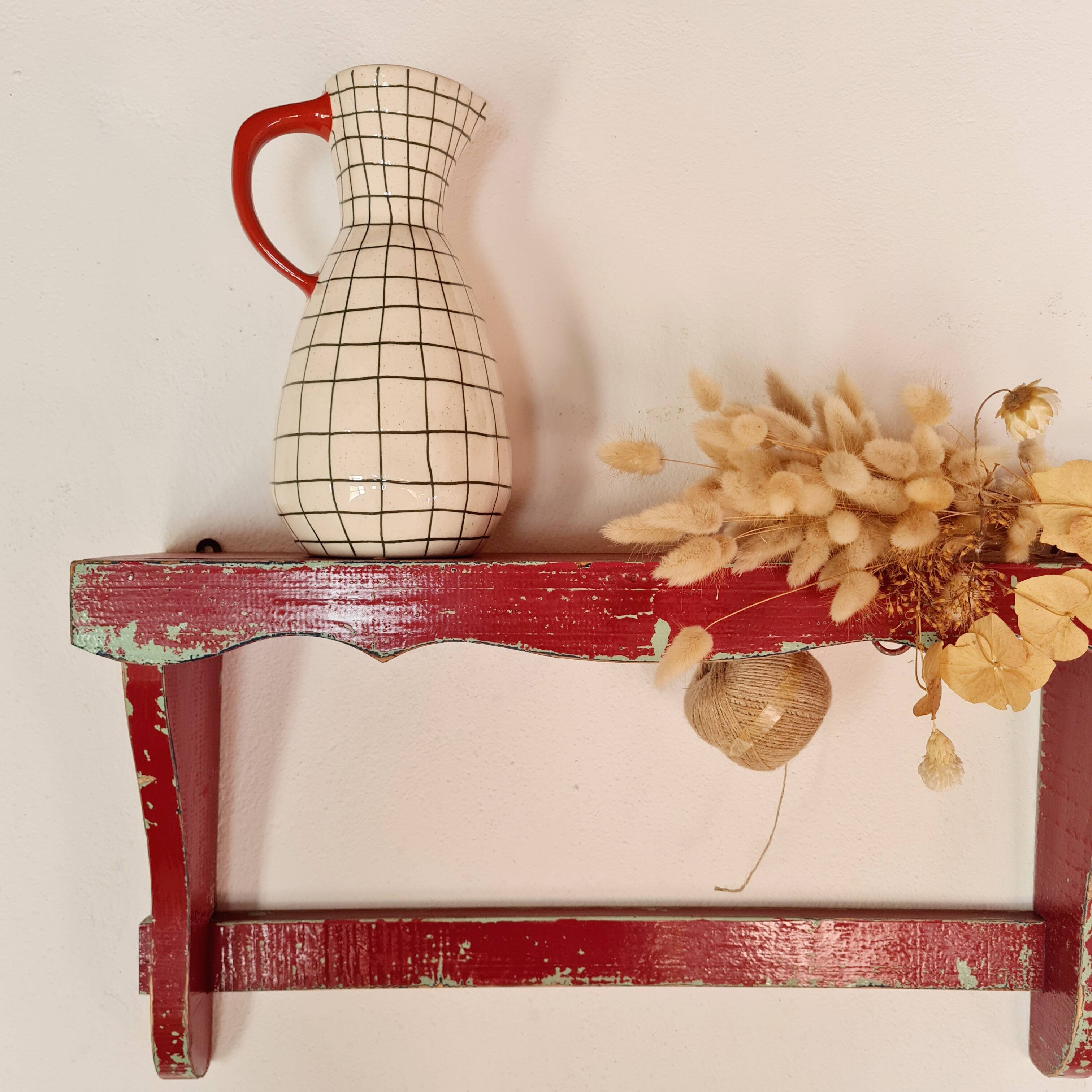 Wall shelf in garnet red wood