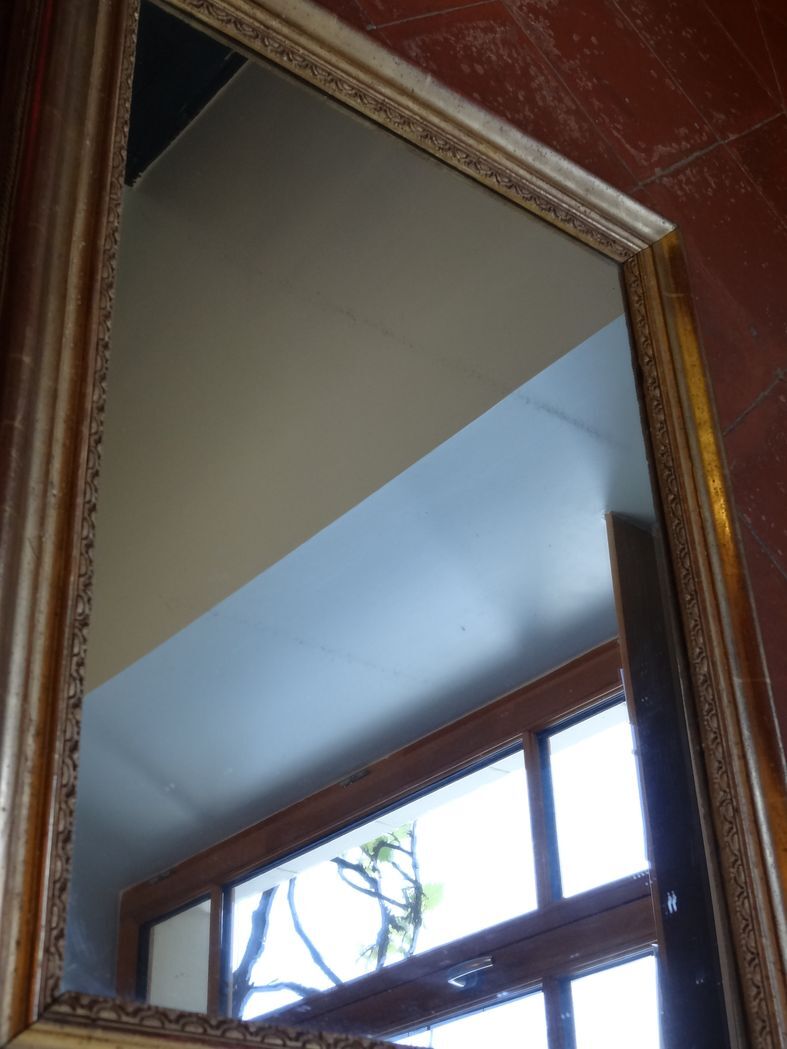 Empire period mirror, early nineteenth in gilded stucco wood H 72 cm