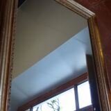 Empire period mirror, early nineteenth in gilded stucco wood H 72 cm