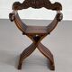Fauteuil pliant vintage en bois sculpté