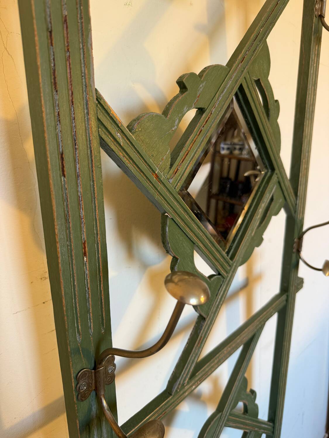 Art Deco coat rack in green patinated wood