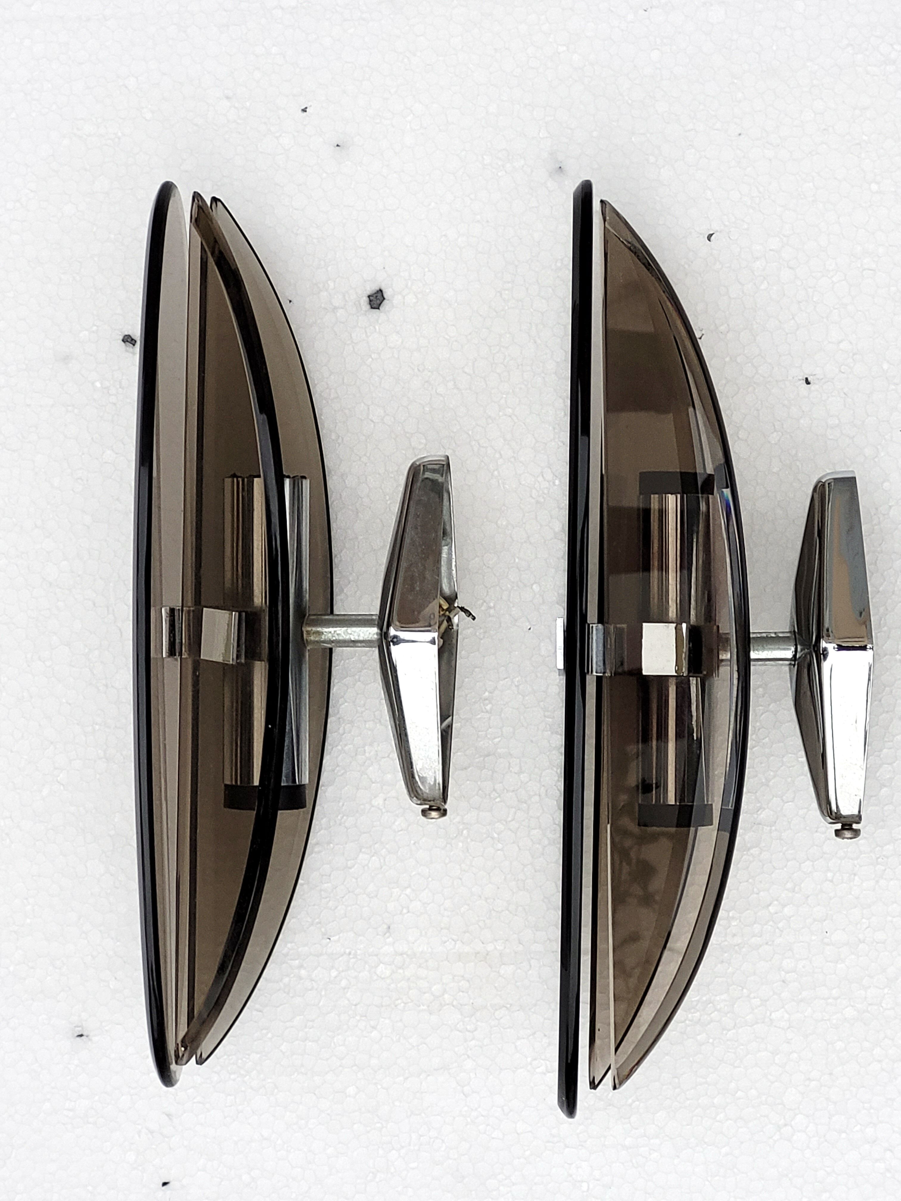 Pair of elliptical italian wall lamps in smoked glass and chrome veca