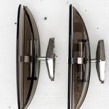 Pair of elliptical italian wall lamps in smoked glass and chrome veca