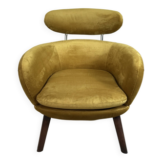 Mustard yellow velvet armchair from the 2010s.