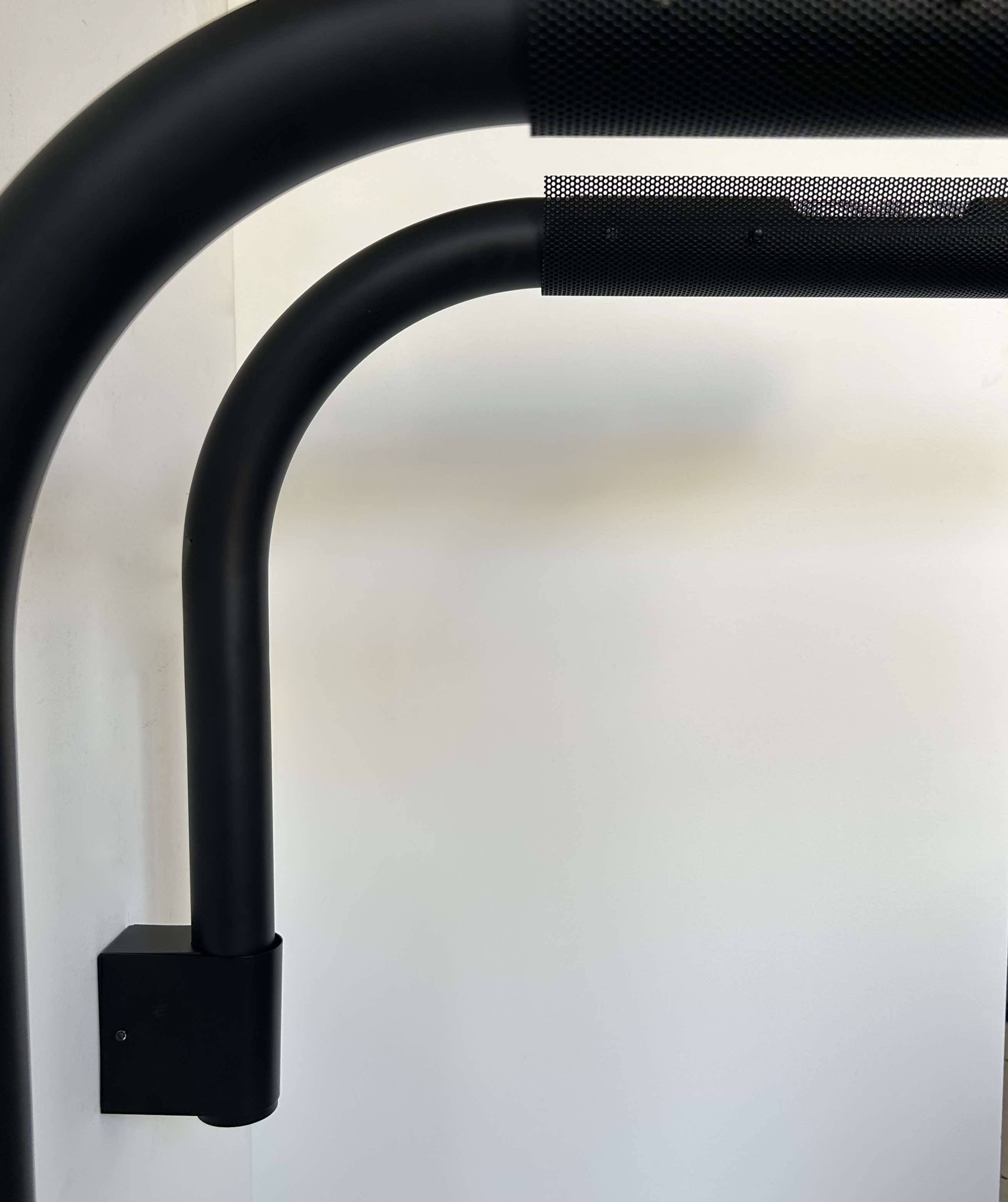 Pair of vintage wall lights, tubular and perforated black metal, Parscot France 1980