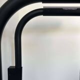 Pair of vintage wall lights, tubular and perforated black metal, Parscot France 1980