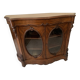 Curved mahogany display cabinet from the Napoleon III period. It has two doors and two shelves.