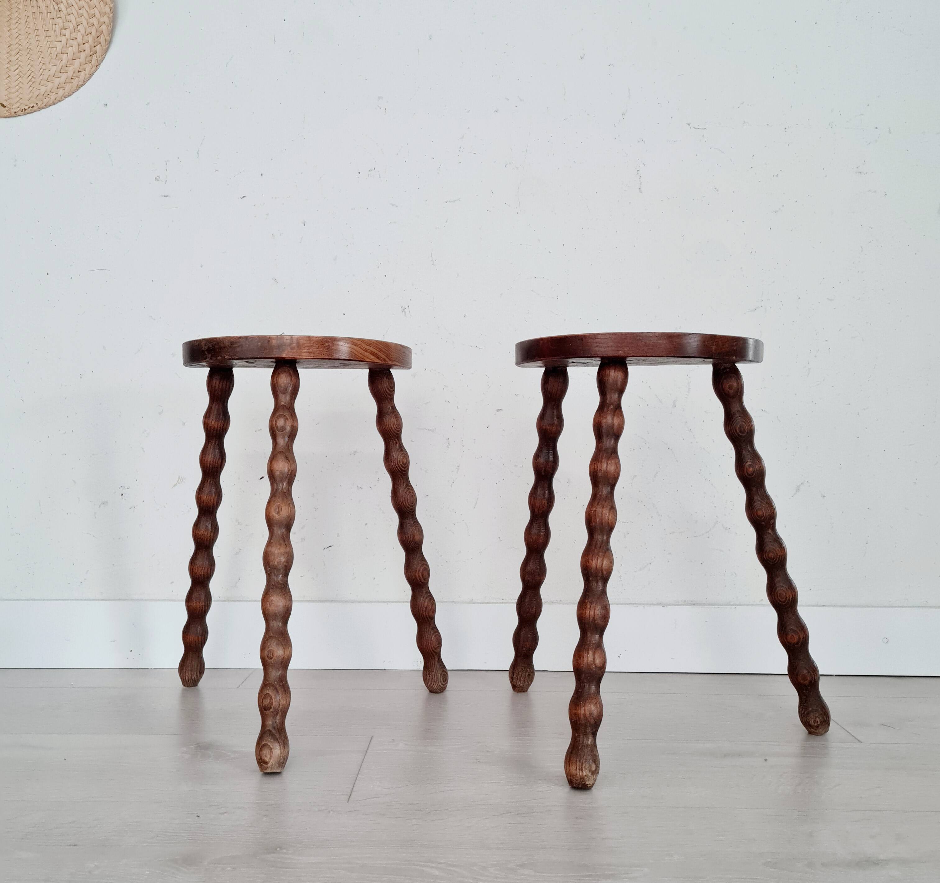 Pair of old wooden tripod stools