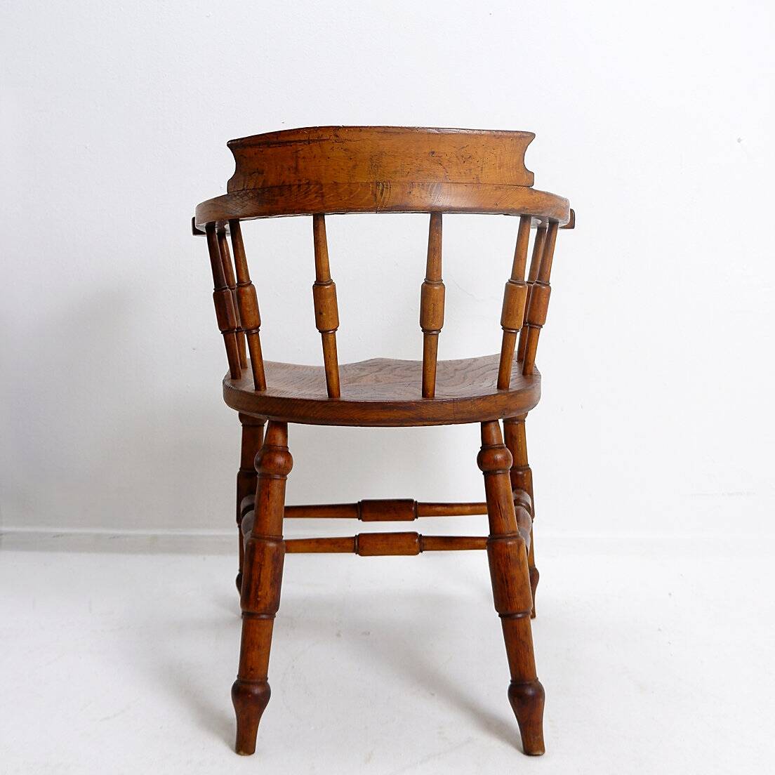 Elm armchair with curved back