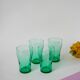 Set of 4 green glass glasses 1970