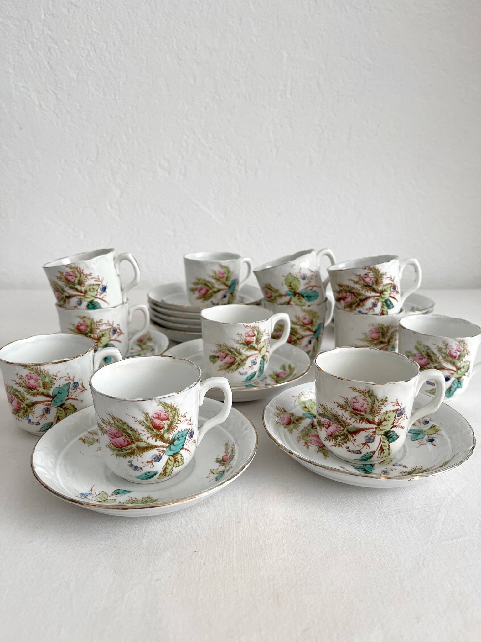 12 ironstone coffee cups with polychrome floral decoration, KG Lunéville