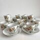 12 ironstone coffee cups with polychrome floral decoration, KG Lunéville