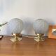 Pair of Art Deco glass globe table lamps with brass base.