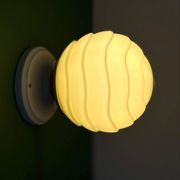 Vintage Art Deco globe wall light in pale yellow opaline.