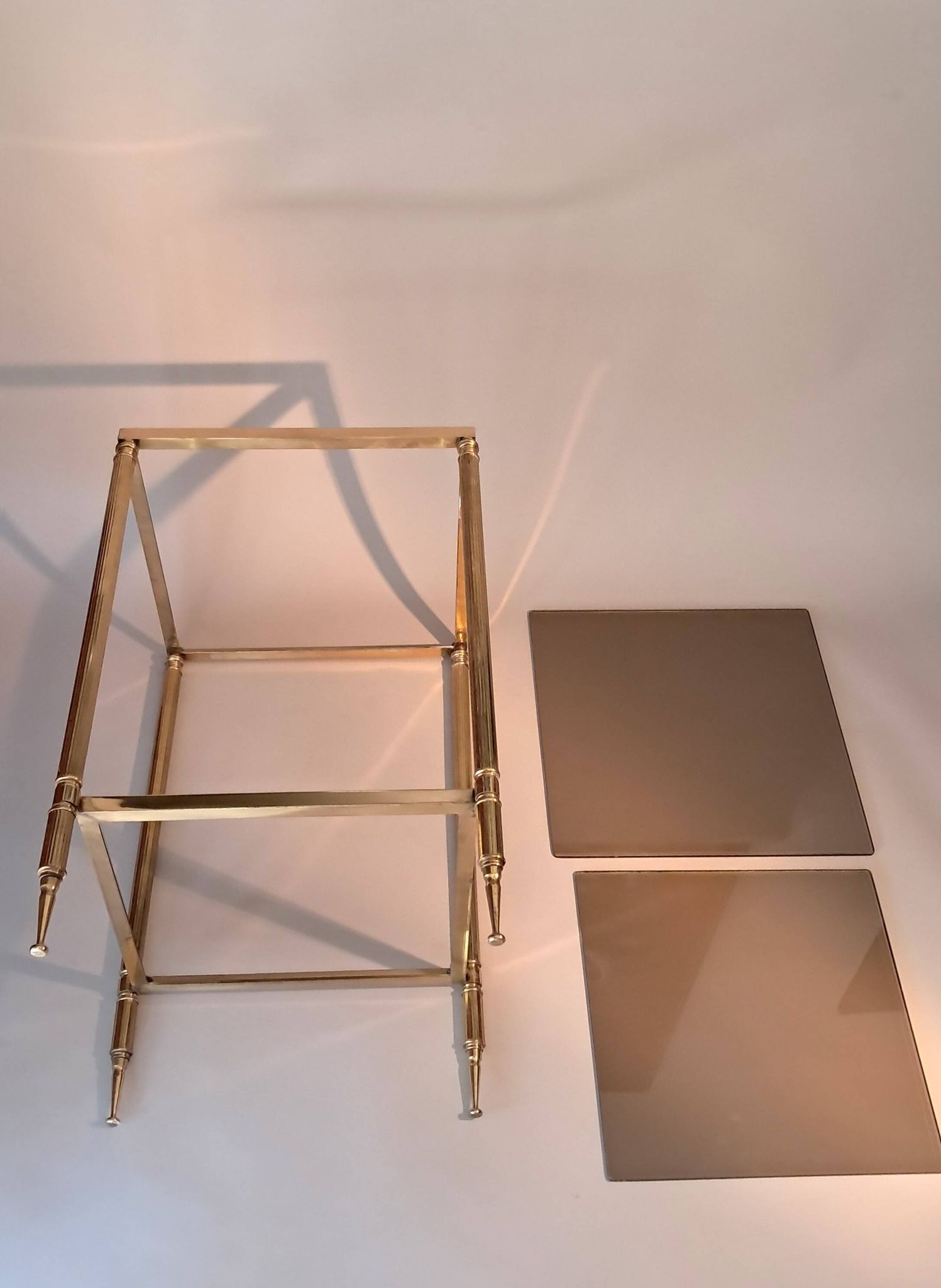 Gilded brass and smoked glass end table, 1960s.