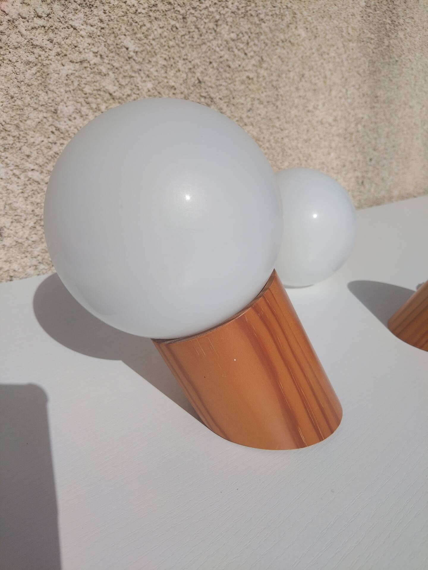 Pair of vintage wall lights in varnished pine and opal glass, 1970s-80s.