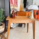 Old wooden desk or side table with compass legs