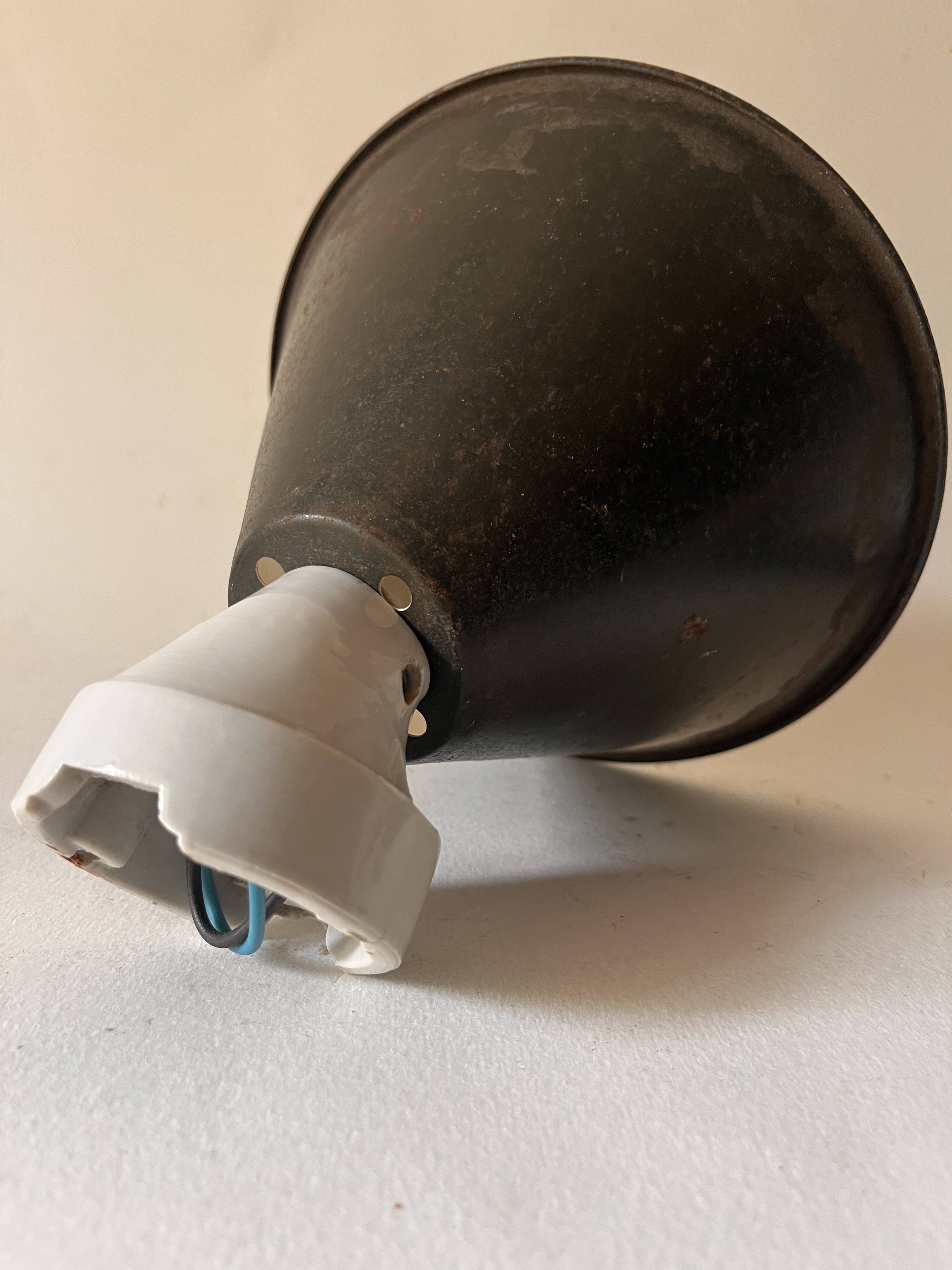 Conical wall light on porcelain base