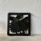 Cast iron trivet with sunflower decor