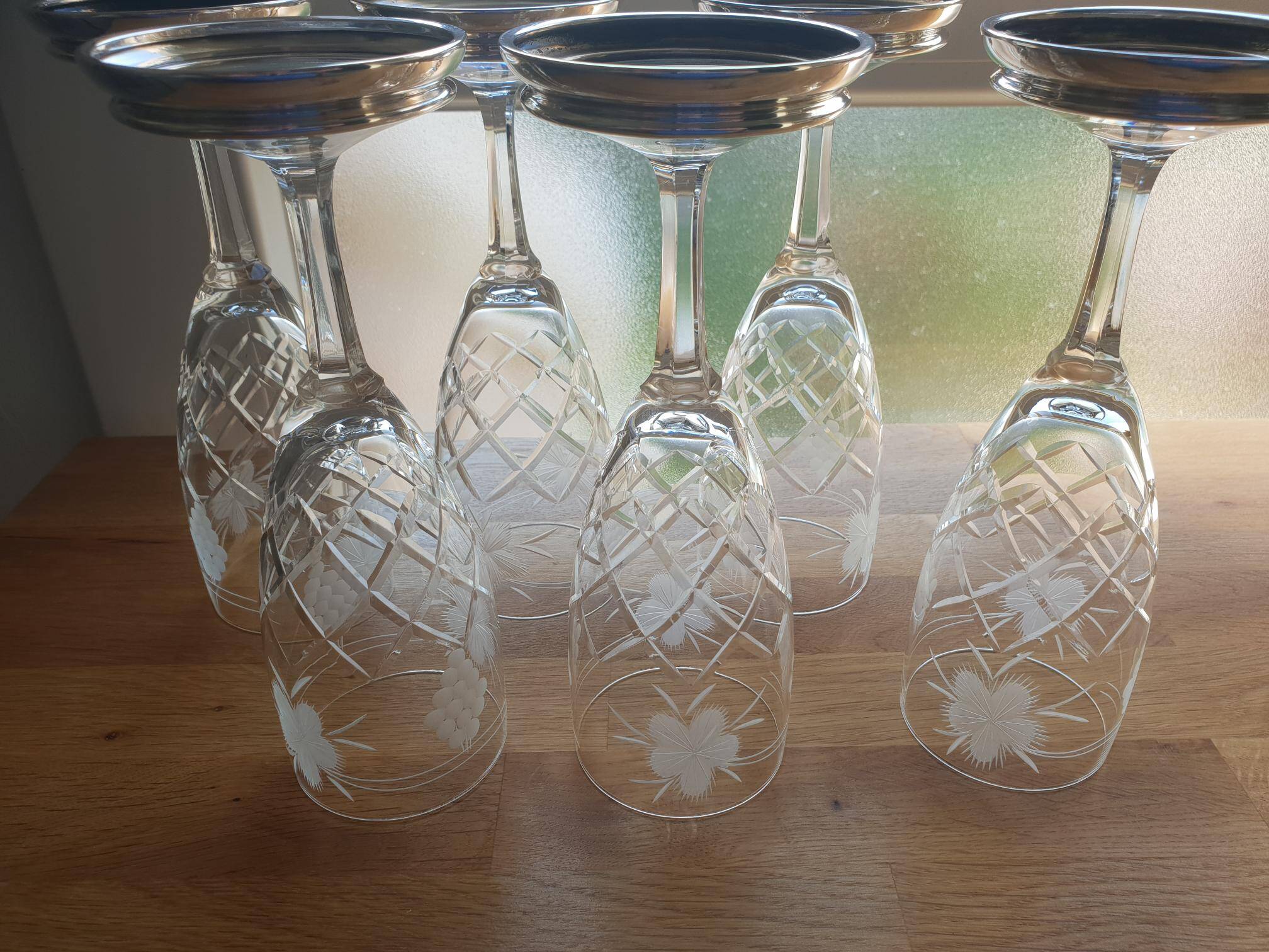 Crystal flutes with a silver rimmed foot