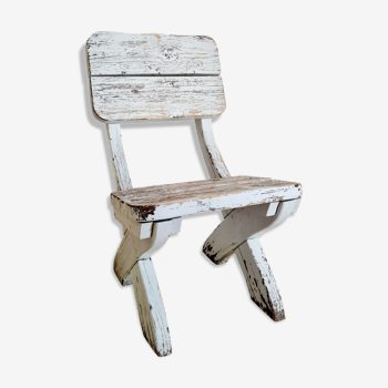 Patinated white old garden chair