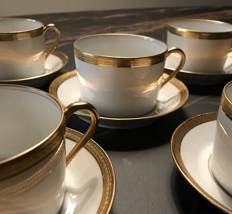 5 Haviland tea cups and sub-cups