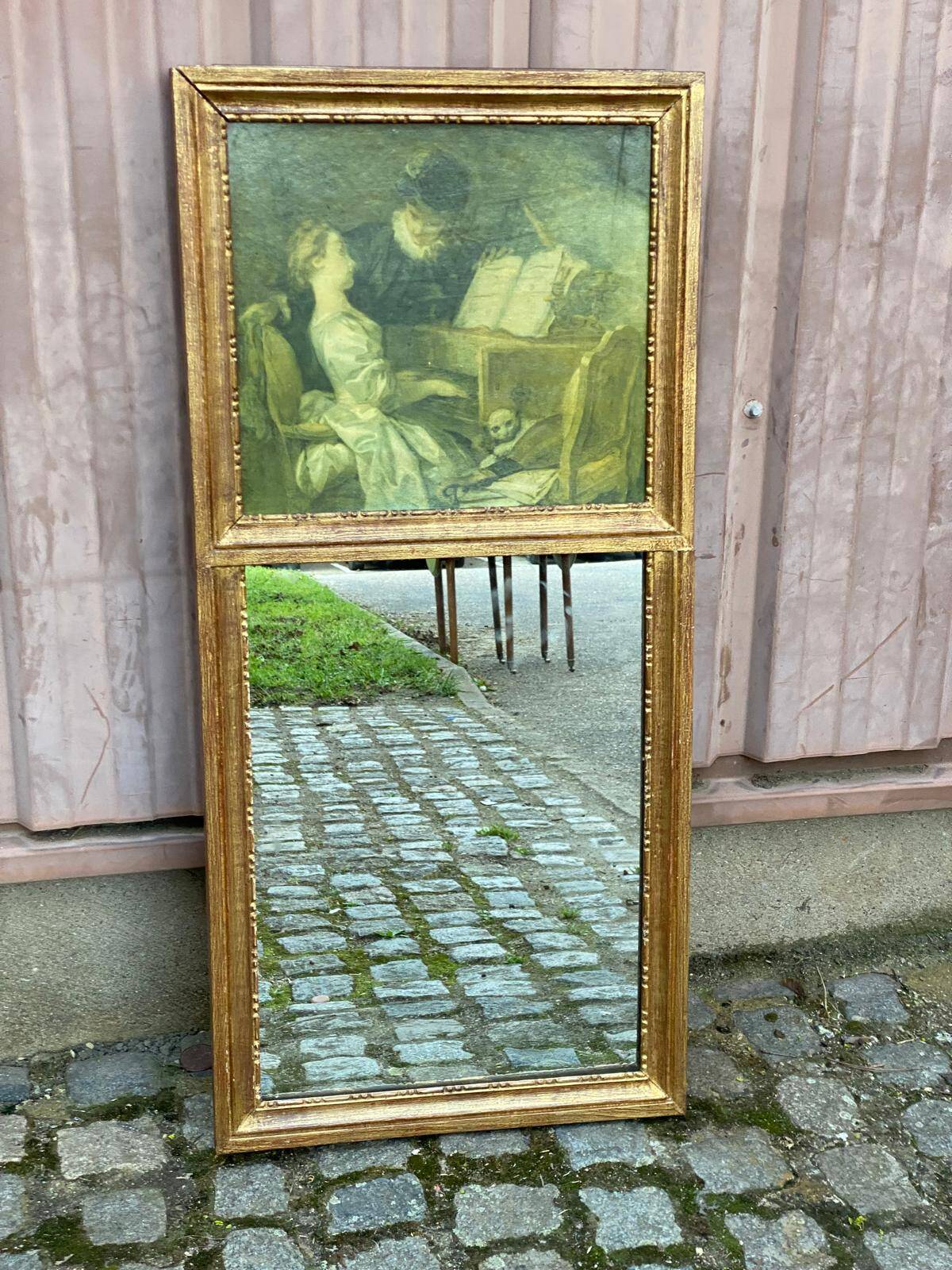 19th-century trumeau with mirror and music lesson canvas.