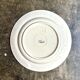 Longchamp flat plate in iron earth, “Lily” service