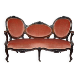 Very large Louis XV style mahogany banquette with medallions from the 19th century.