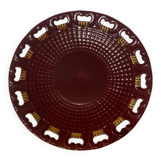 Burgundy and gold openwork plate in ceramic from Saint-Clement, 1950s.