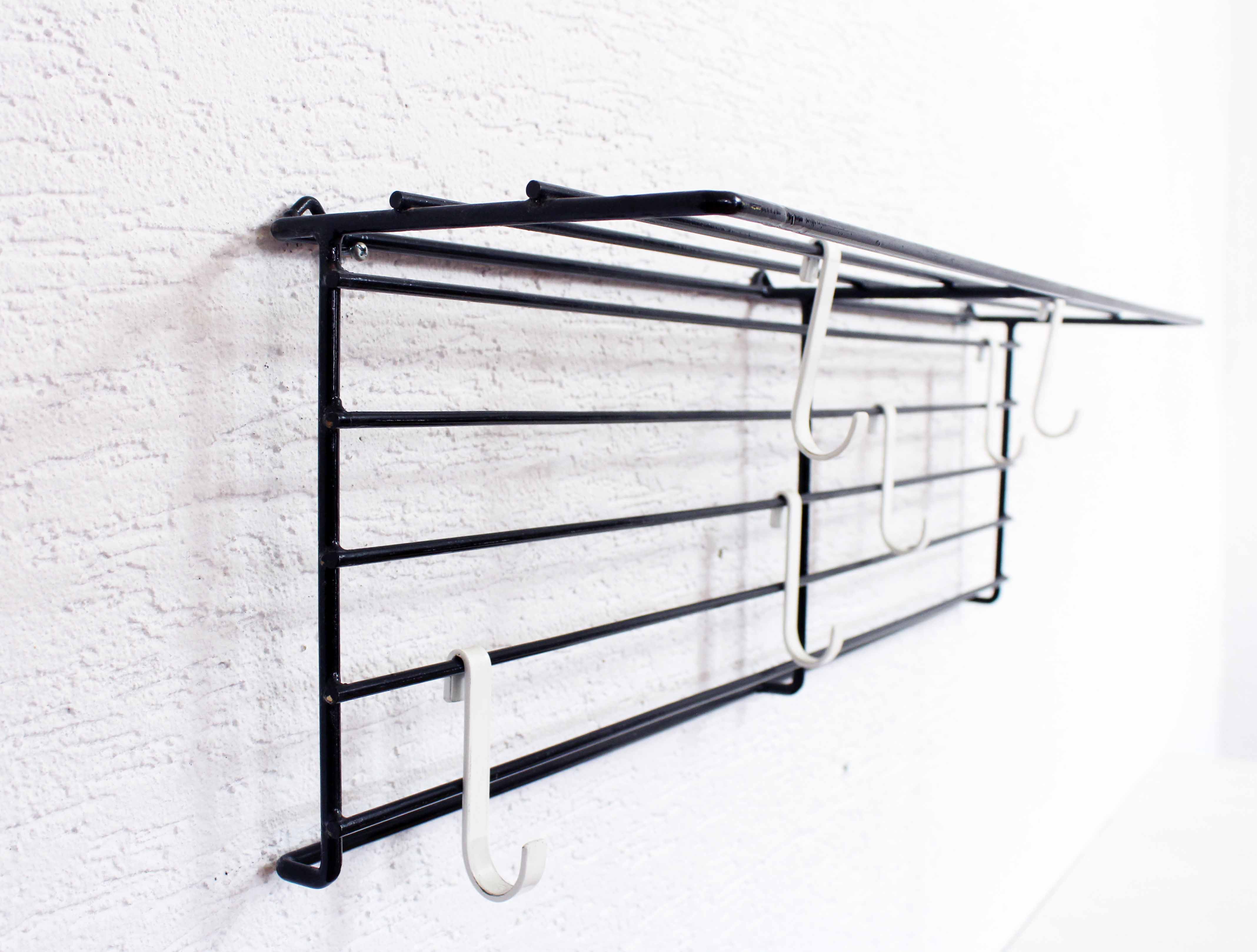 Wall coat rack with removable hooks