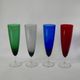 Set of 4 designer champagne flutes in colored glass from the 70s