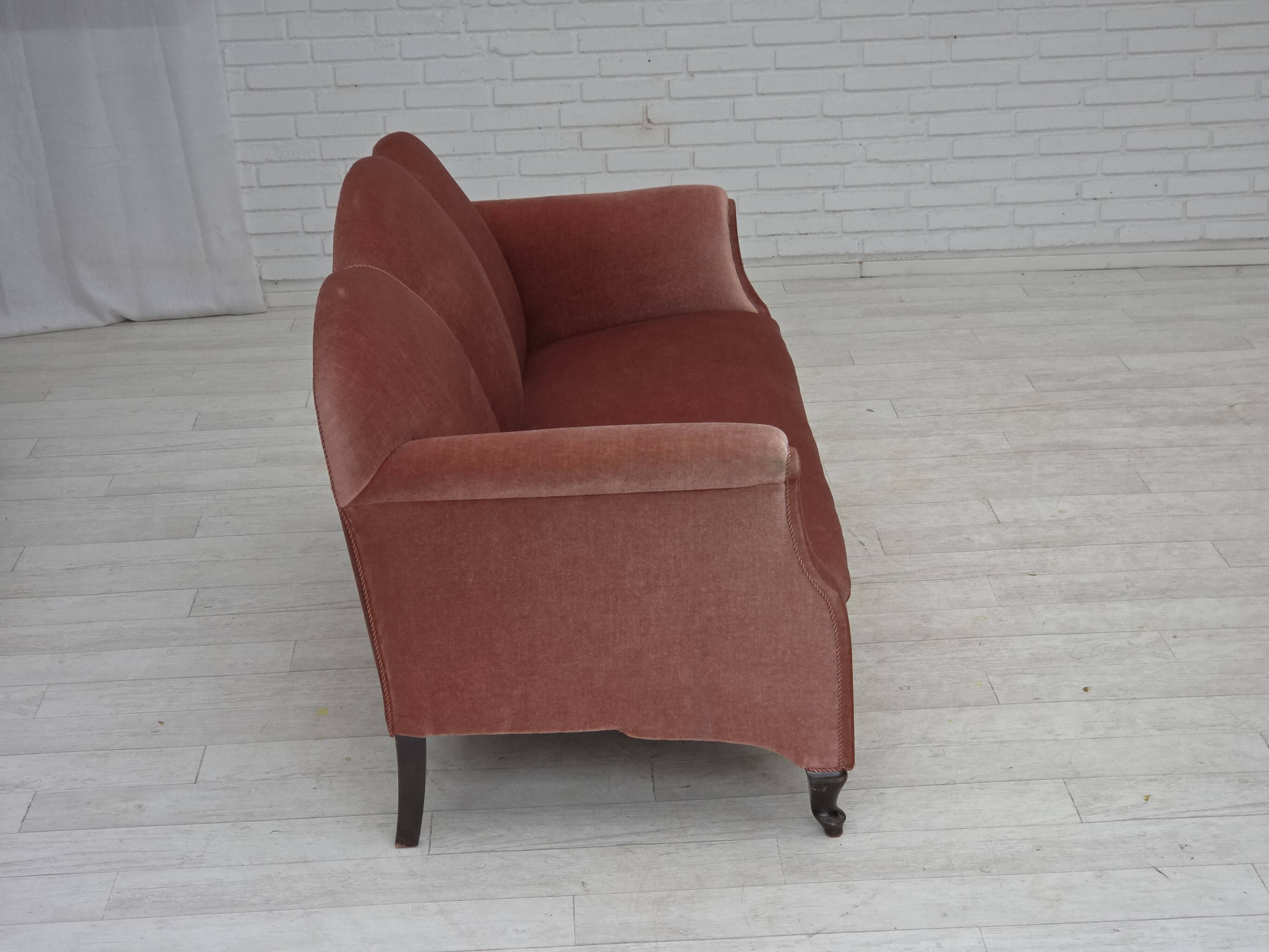 1950s, Danish 2-seater sofa, salmon pink furniture velour, oak wood legs.
