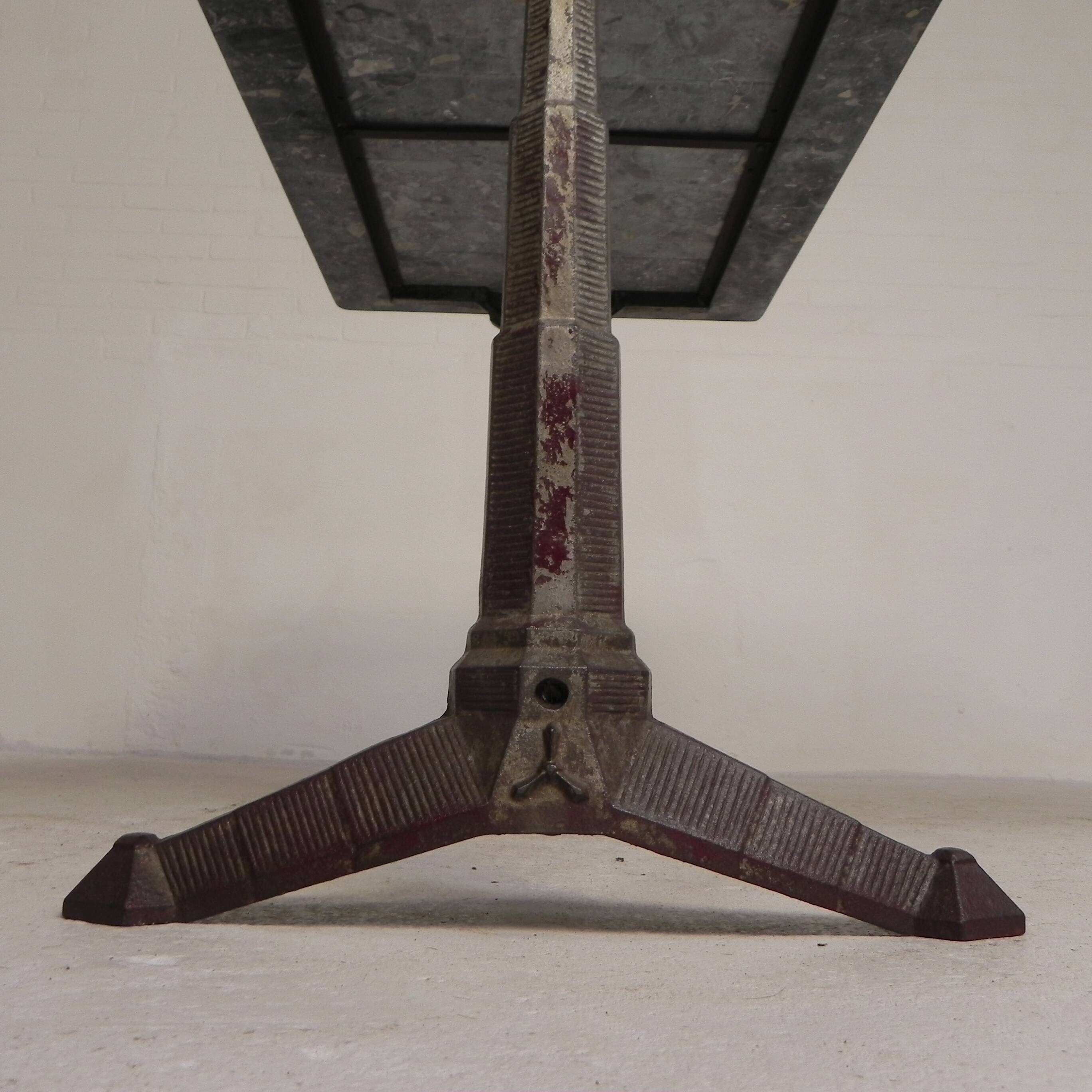Bistro table with a marble top on a cast iron frame, 1930s.