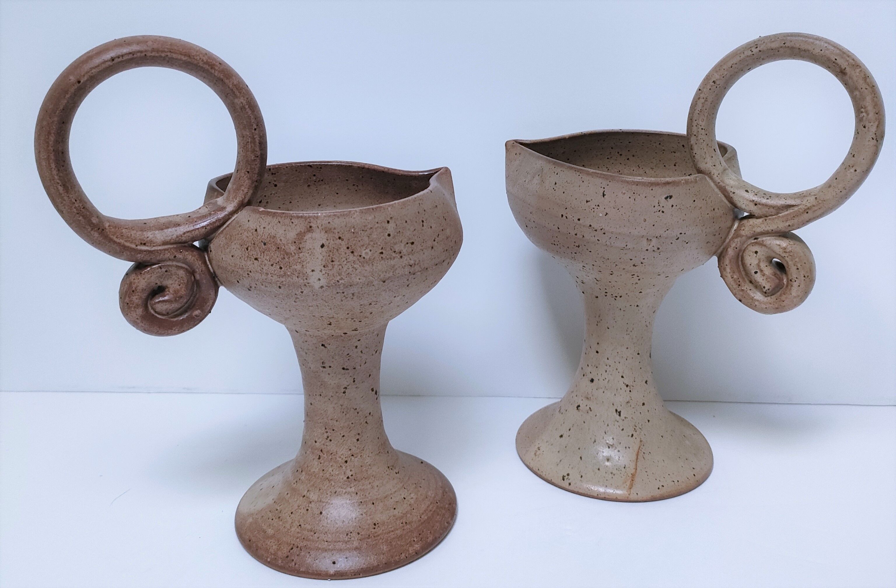 Pair of vintage “heart” sandstone candlesticks