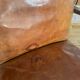 Vintage leather club chair with wooden armrests