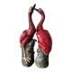 Pair of ceramic red glazed wading bird (crane) figurines.
