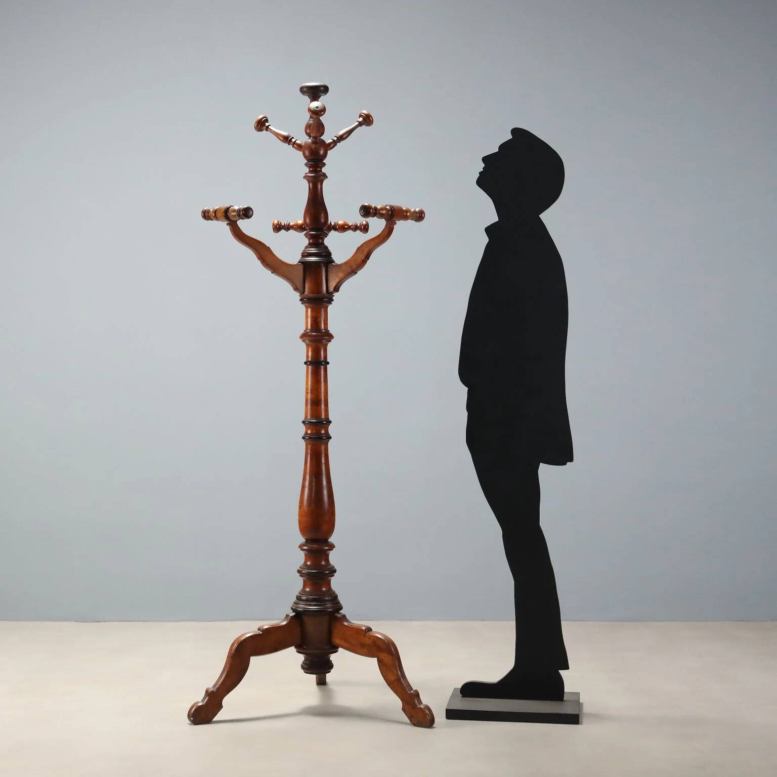 Antique coat rack in lime wood stained walnut, Italy, 19th century.