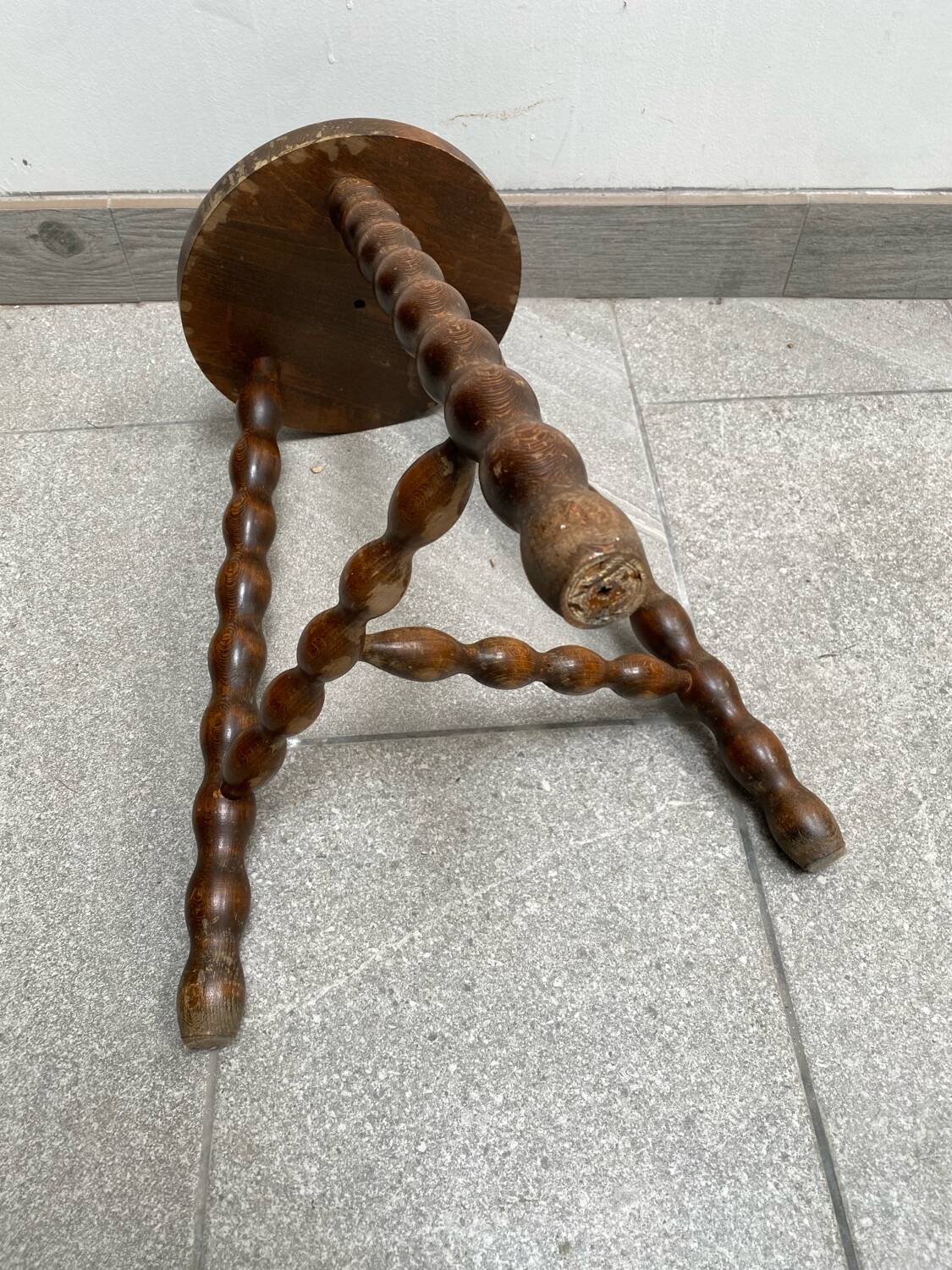 Wooden tripod farm stool